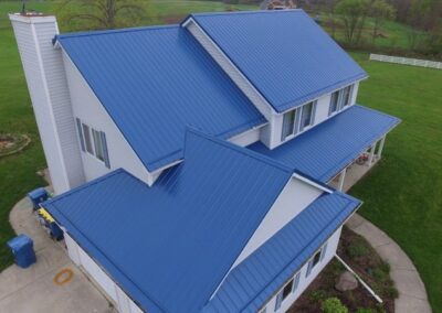 a blue roof with a white house