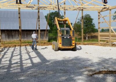 a tractor is working on a wooden frame